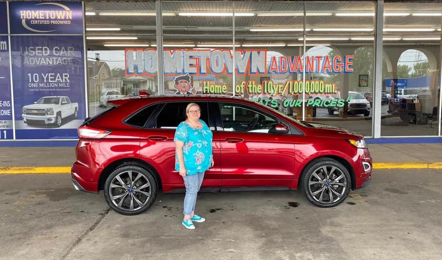 A happy customer with a car purchased from the Hometown CPO dealership in Ironton, OH